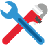 blue standard wrench and red plumbers wrench crossed